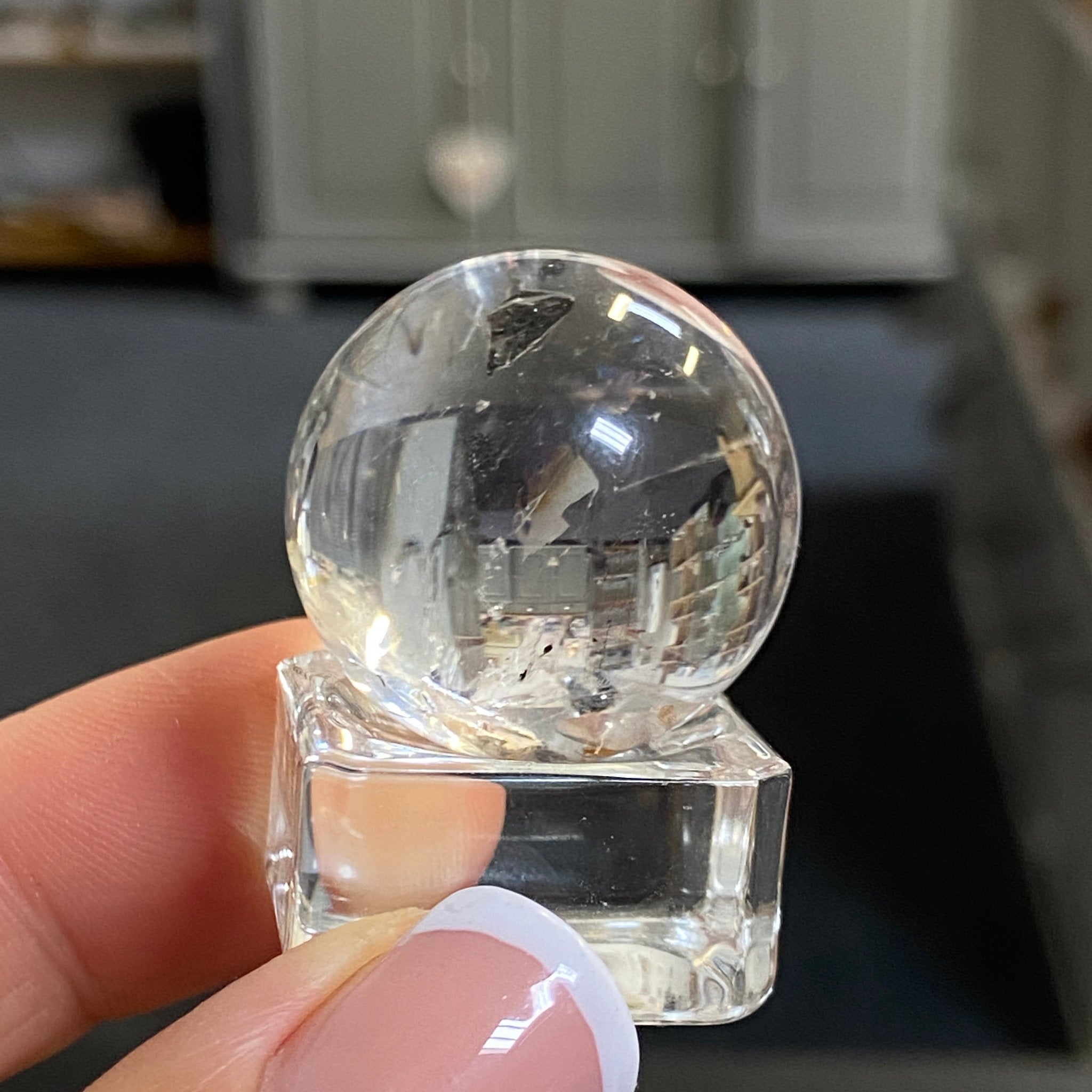 Clear Quartz Enhydro Sphere with Carbon Inclusions