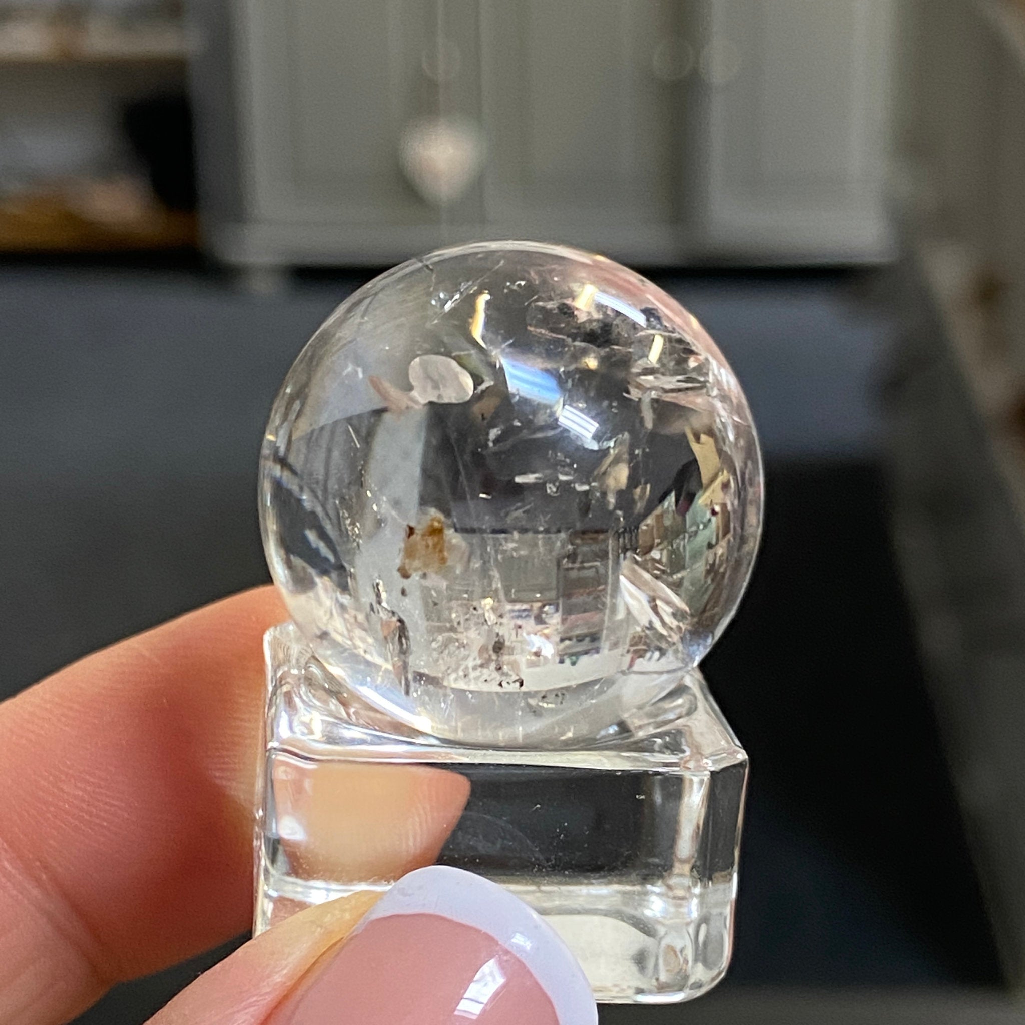 Clear Quartz Enhydro Sphere with Carbon Inclusions