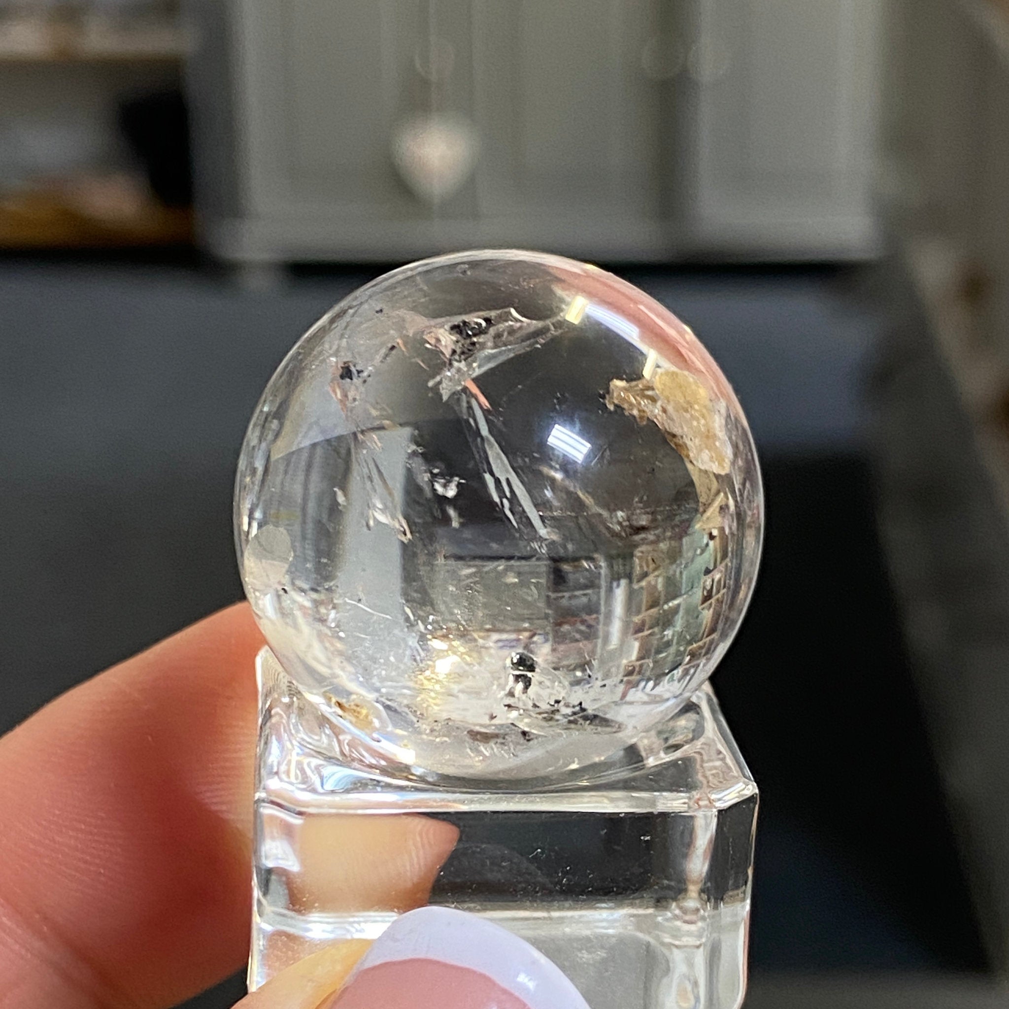 Clear Quartz Enhydro Sphere with Carbon Inclusions