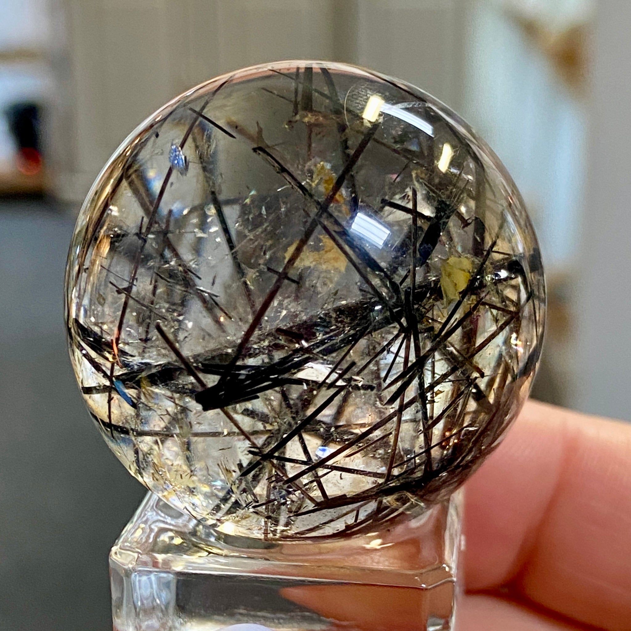 Clear Quartz Sphere with Black Tourmaline and Iron Inclusions