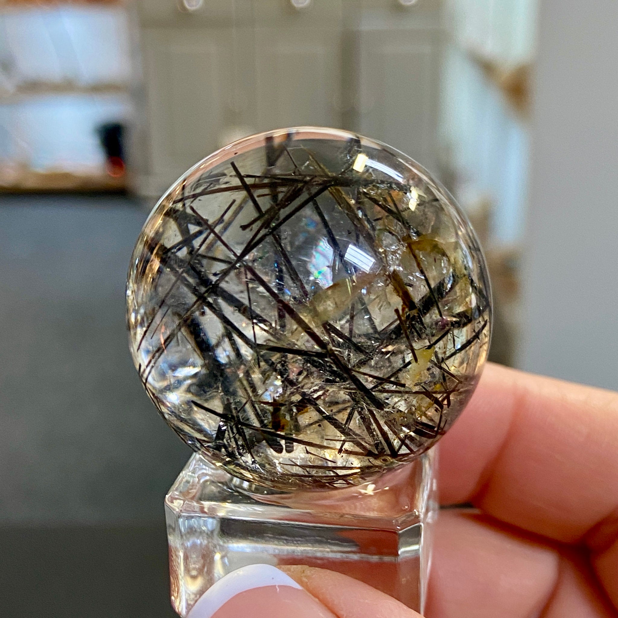 Clear Quartz Sphere with Black Tourmaline and Iron Inclusions