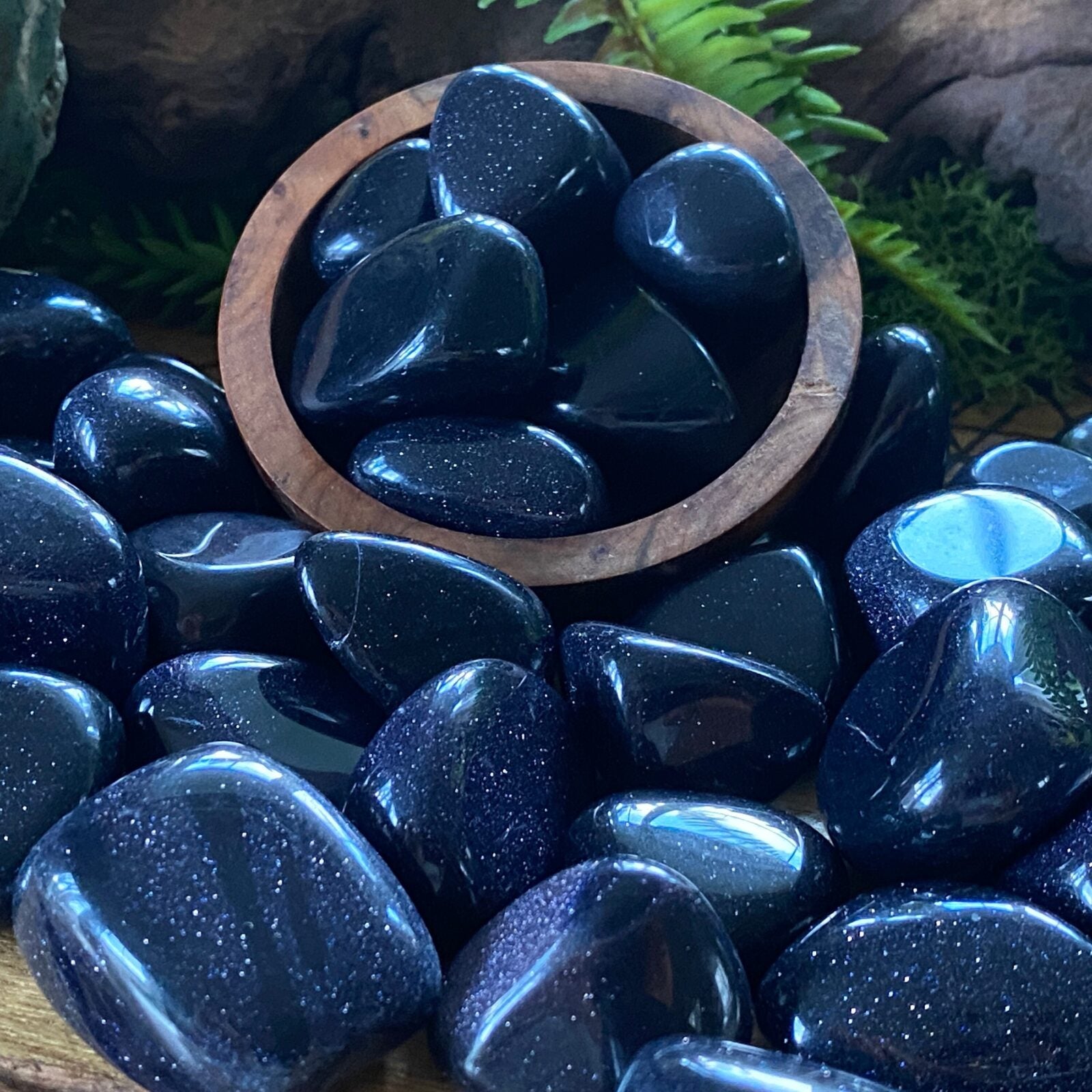 Blue Goldstone tumbled stones.