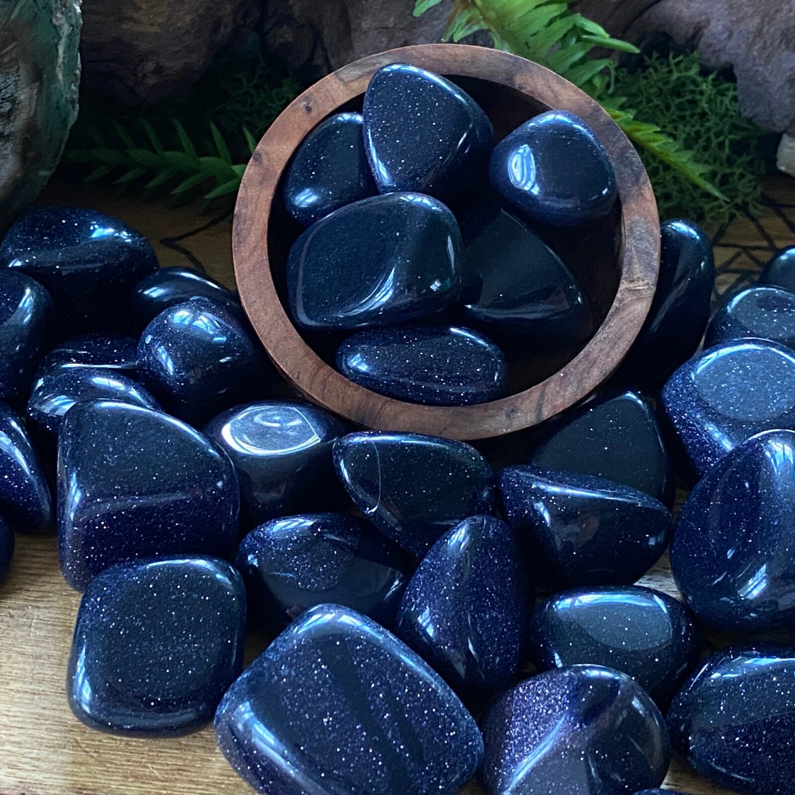 Blue Goldstone tumbled stones.